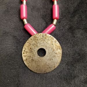 Chico's pink and silver hammered donut pendant